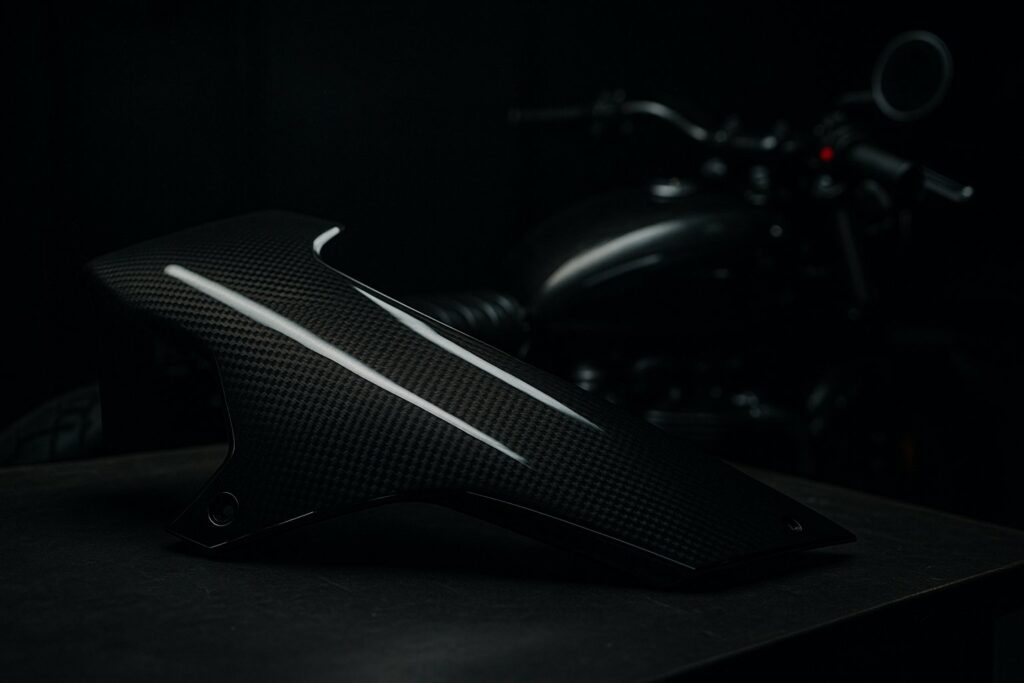 A hydrodipped motorcycle fairing panel with a carbon weave pattern